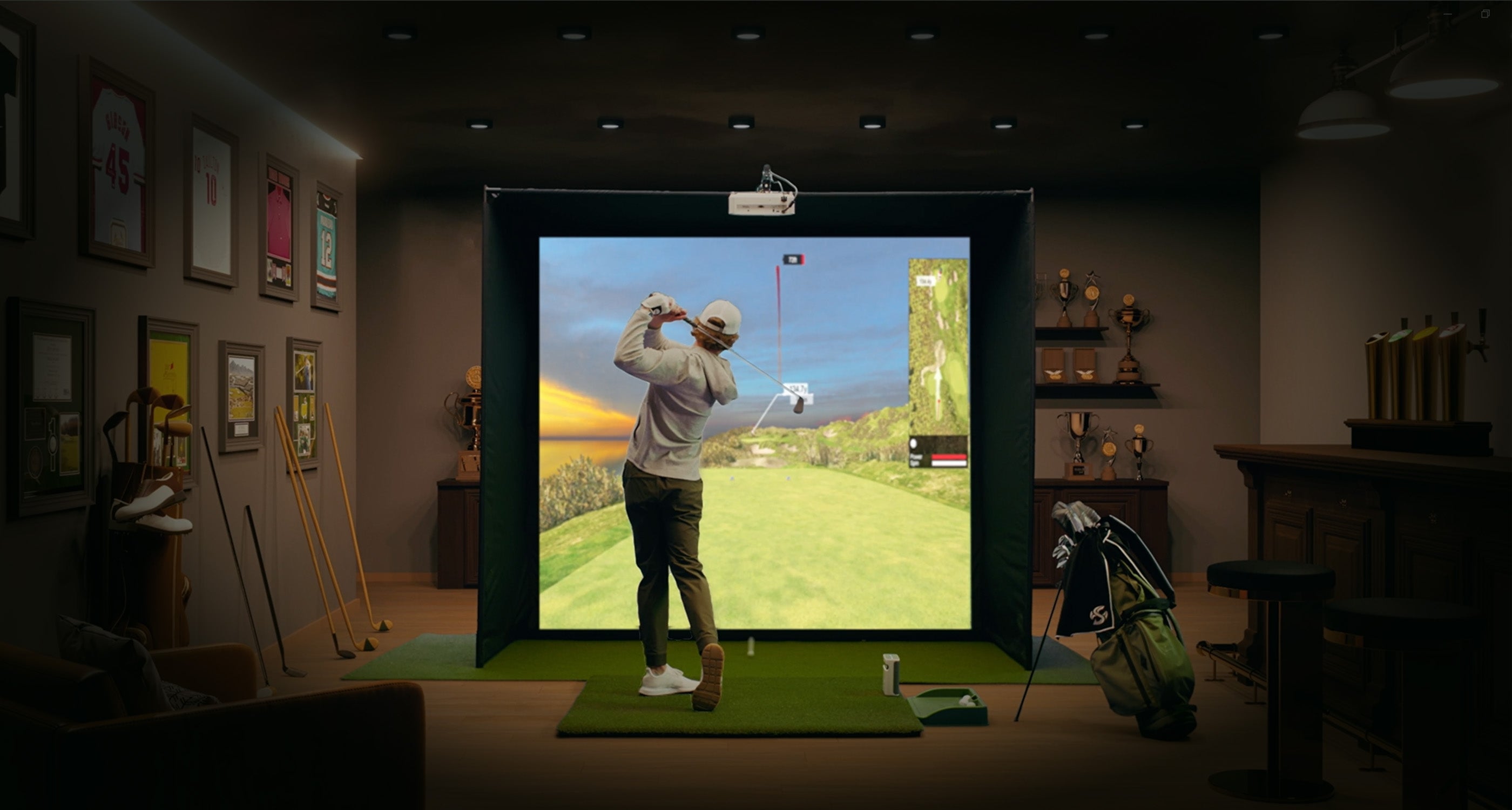 Guy playing indoor golf simulator in man cave with SKYTRAK plus launch monitor