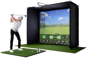 Golfer hitting on a SkyTrak Golf Simulator Studio with the SkyTrak+ Launch Monitor