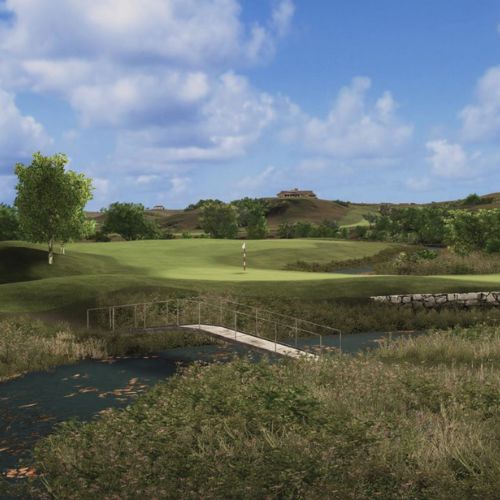 Hawktree course with a green and trees under a blue sky view of water separating green