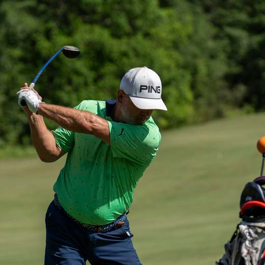 Man hitting golf shot working on improvement 