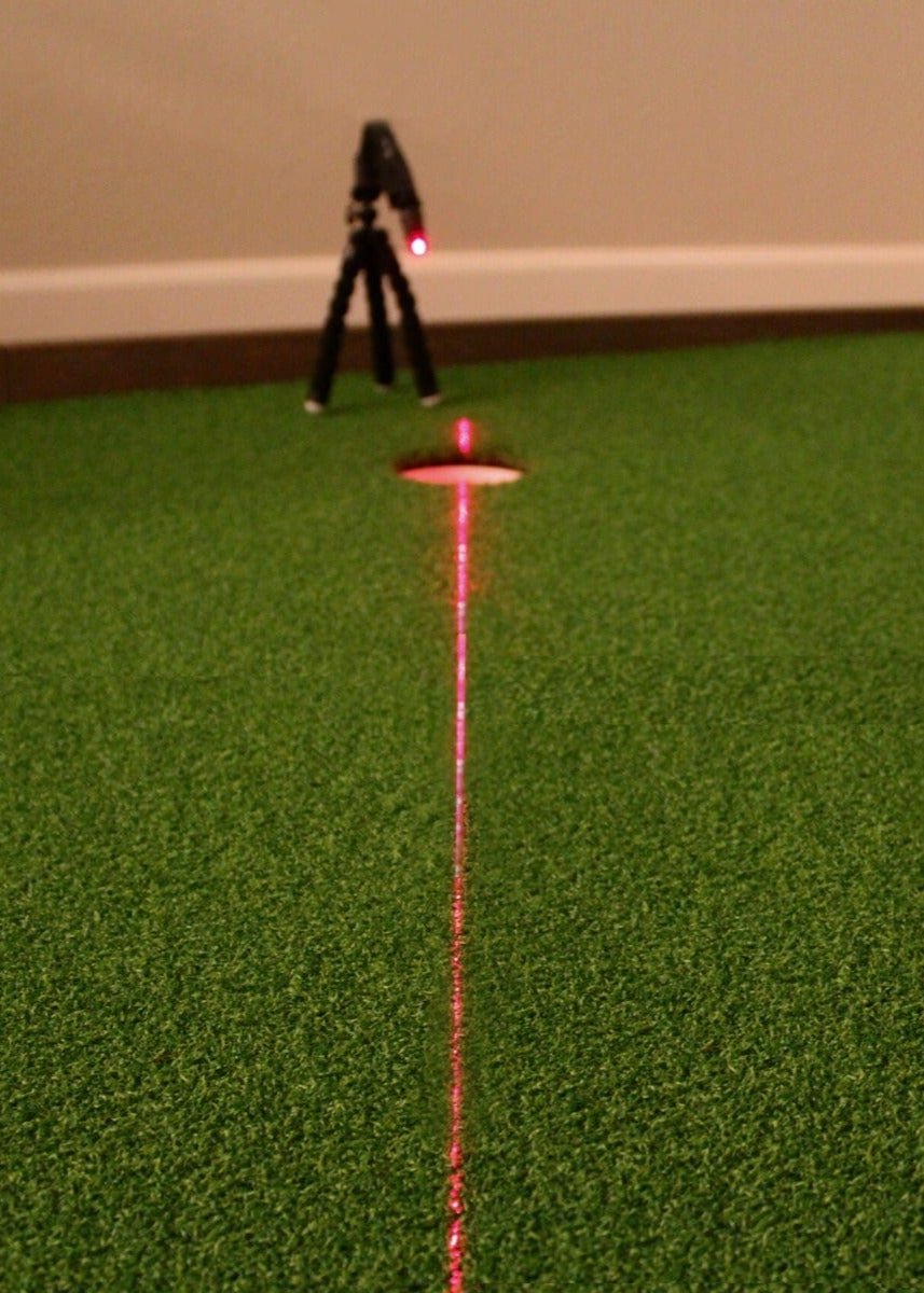 Tripod and laser in action, highlighting the target line for where to aim your putt