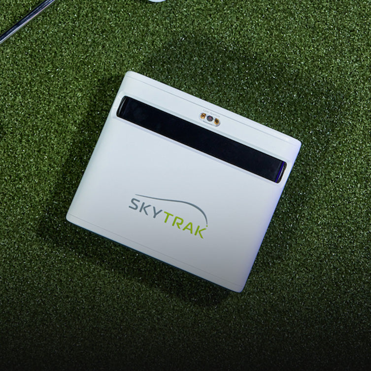 SKYTRAK plus launch monitor on hitting mat golf sim accessories