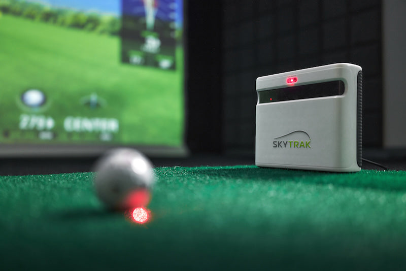 Ball lined up on the targeting laser of the new SkyTrak+ launch monitor. With a dual doppler radar and Photometric Camera System for more accuracy