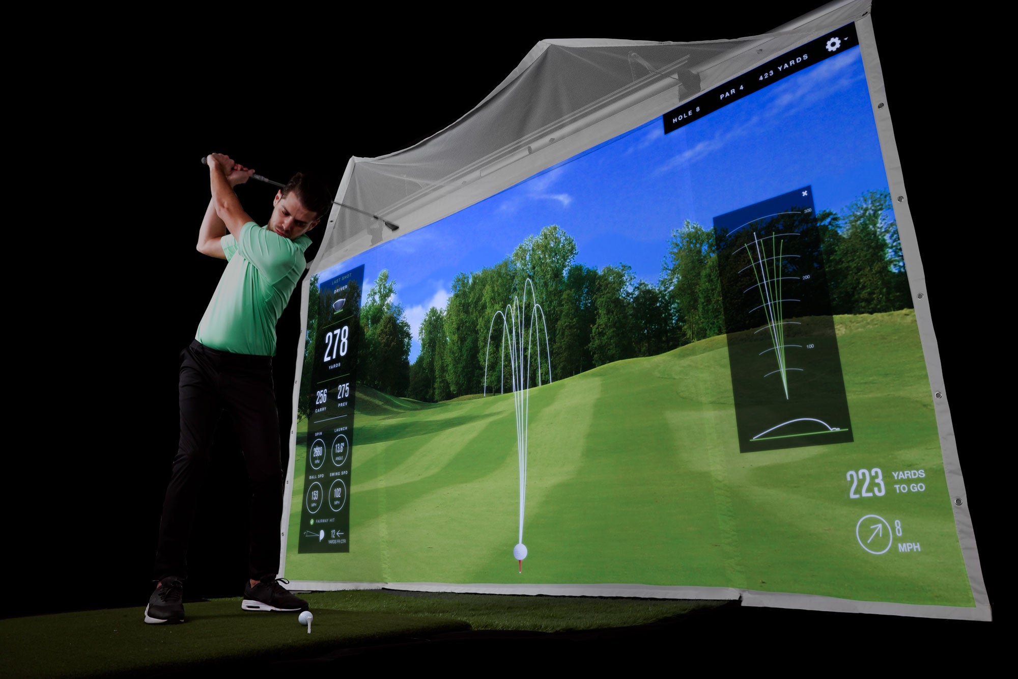 HomeCourse ProScreen 180 enclosure with golf sim in action