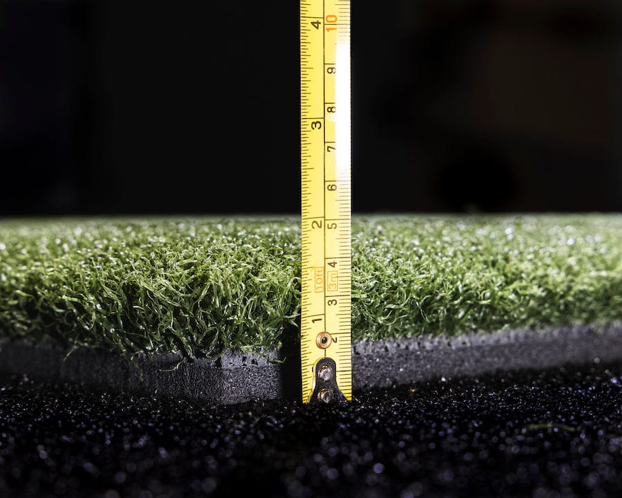 Thickness of the 5 by 5 hitting mat SkyTrak golf simulation accessories