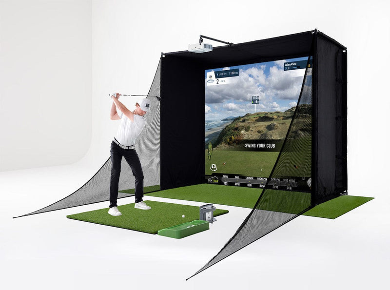 Practicing on SKYTRAK golf mat with SKYTRAK+ Launch monitor and enclosure