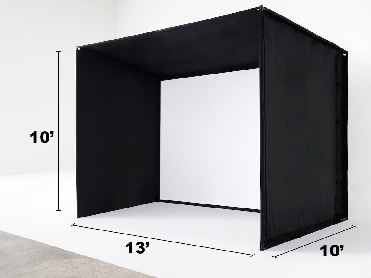A black studio enclosure with a white impact screen designed for golf practice, standing against a white background.