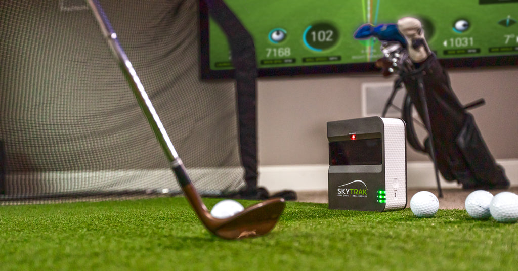 Hitting a wedge shot in a living room with the SkyTrak launch monitor
