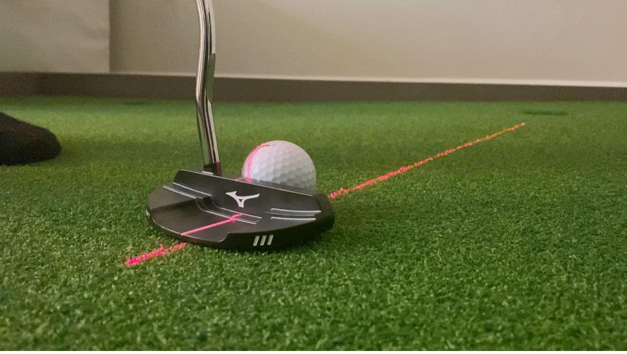 Laser that projects a guide line to improve putting skills 